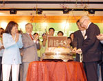 Founder of the Federation, George Stokes cutting the anniversary cake
